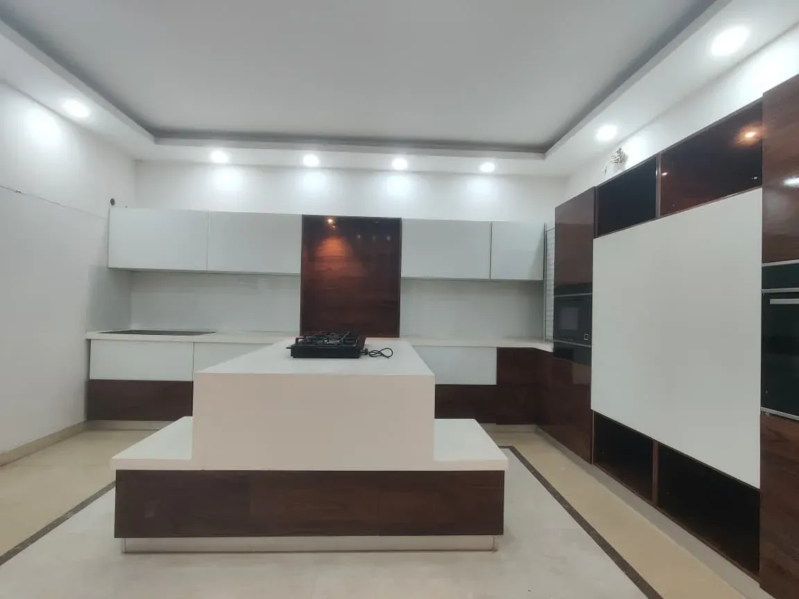 Island kitchen with walnut-finish tall units