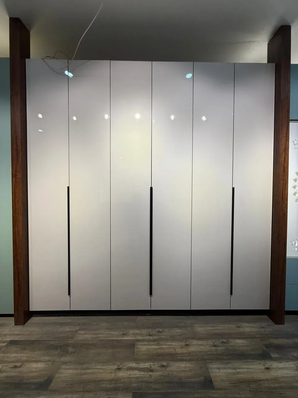 White full-height hinged wardrobe with long black profile handles